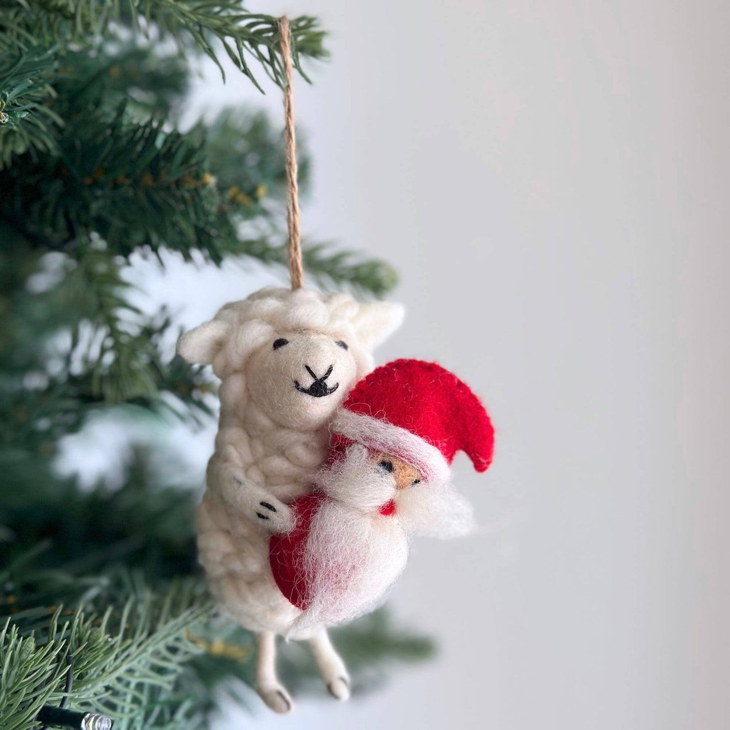 Sheep Holding Santa Ornament