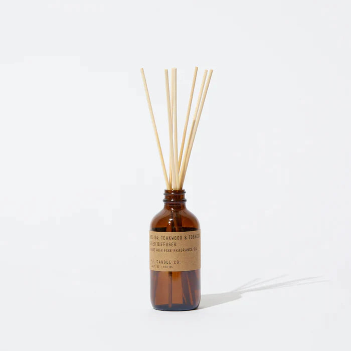 Teakwood & Tobacco 3 fl oz reed diffuser with fine fragrance oil in a 4 oz amber apothecary-inspired bottle with rattan reeds, by PF Candle Co.